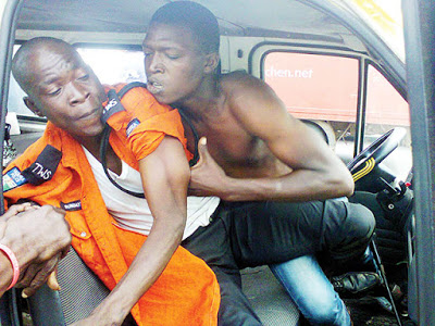 Lagos traffic fight scene. Zikoko half-naked