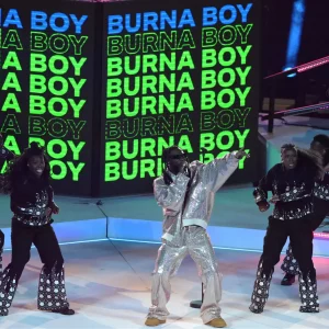 Burna Boy performing at the UCL final