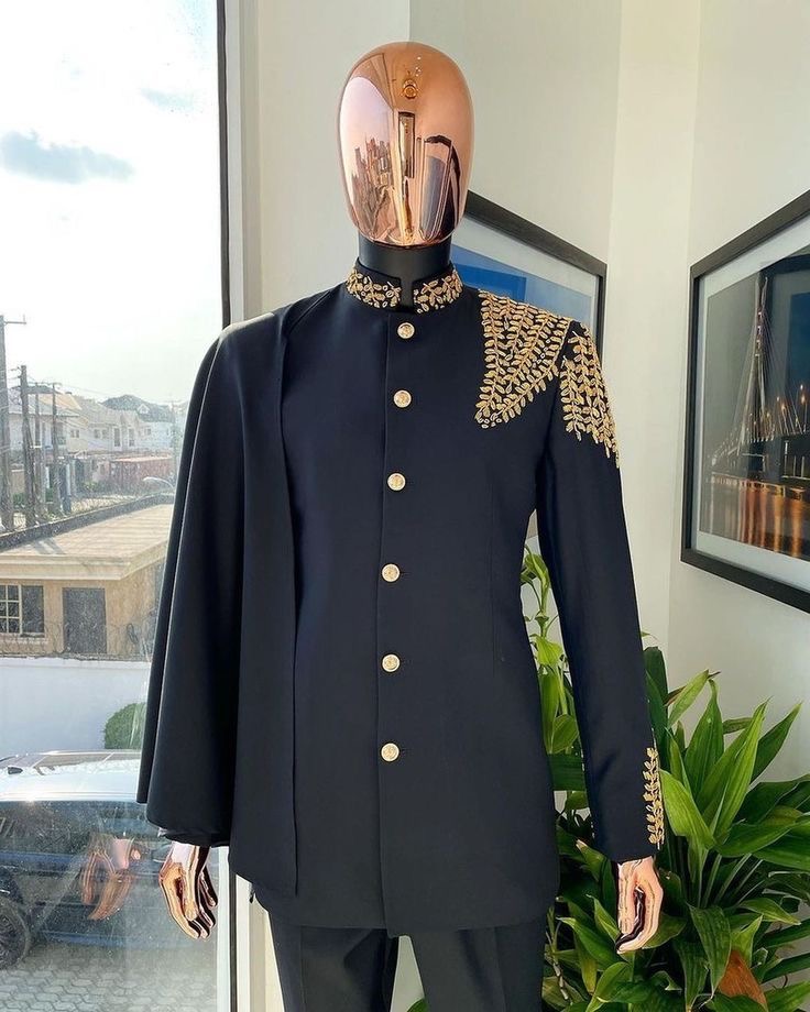 Man Wearing Gold-Leaf Detailed Black Senator With Cape Overlay