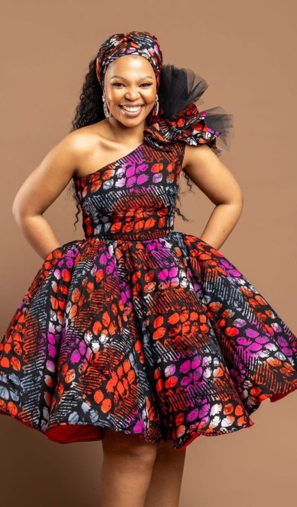 Lady Wearing Statement One-Shoulder Flared Dress with Pockets