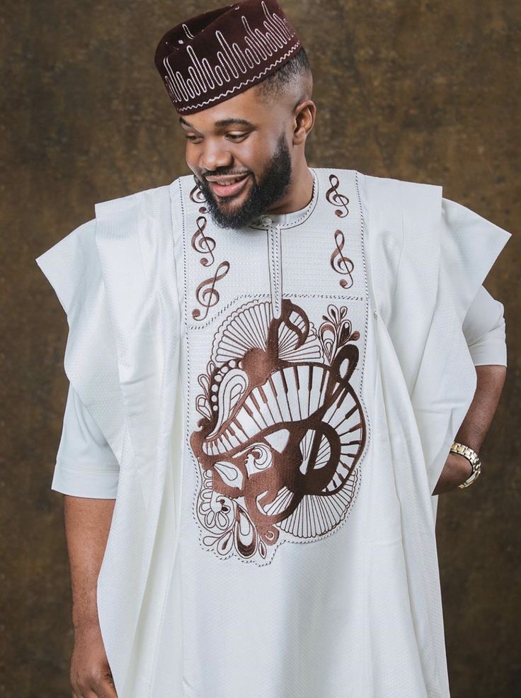 Man wearing The White Harmony Ensemble Agbada style for men