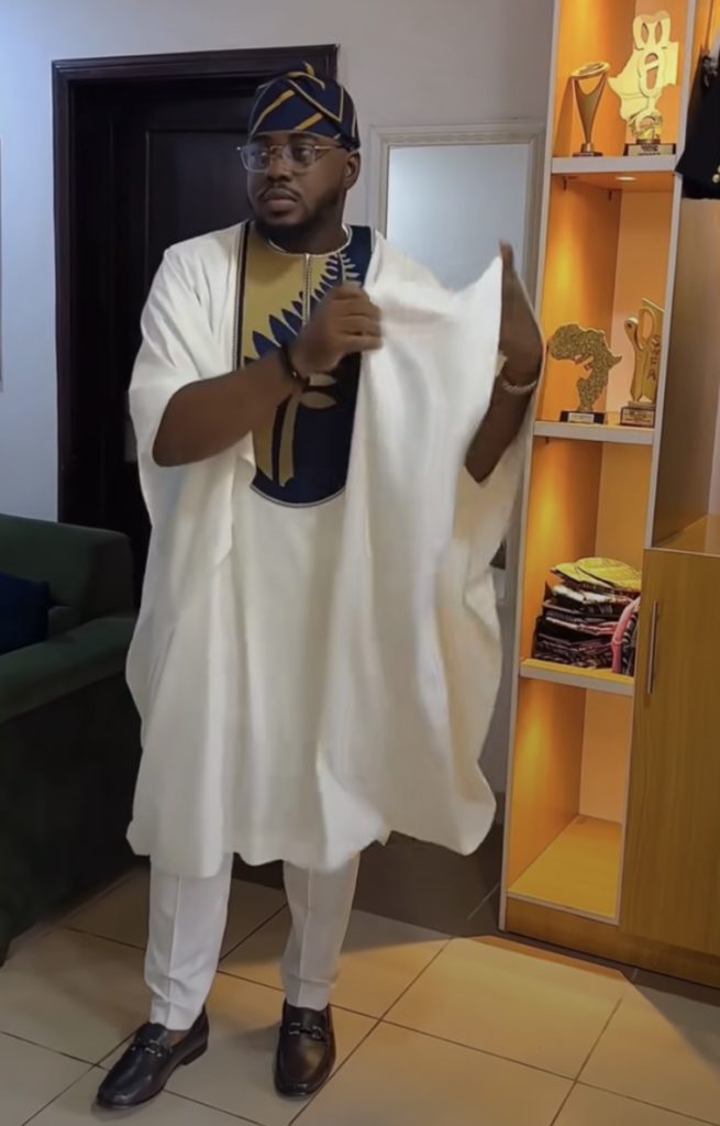 Man wearing The White & Navy Royal Contrast Agbada style for men