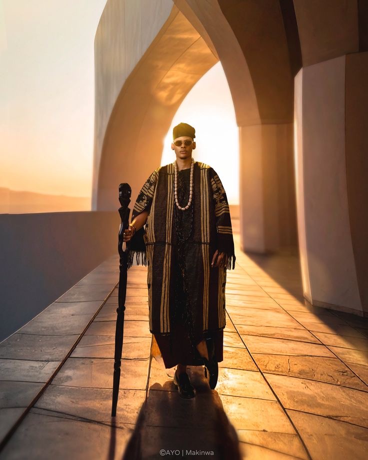 Man wearing Black and Gold Aso-Oke Agbada style for men