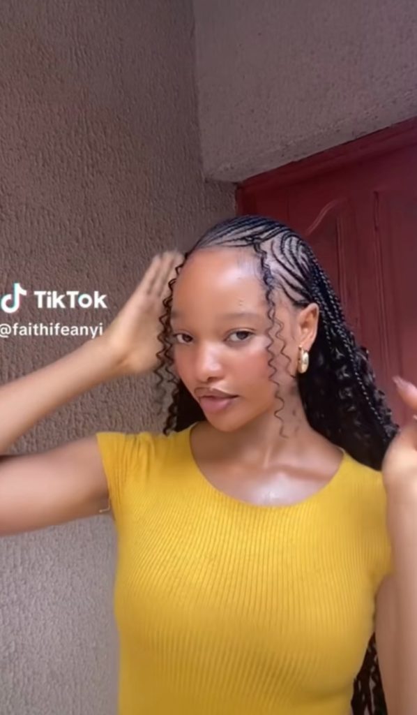 Lady on Tribal braids Side Part Cornrows with Spiral Tendrils