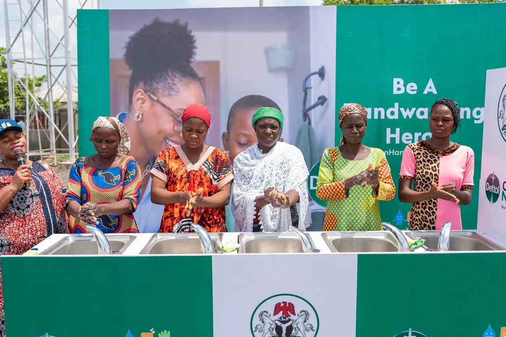 Mothers in Nigeria practicing good hygiene habits.